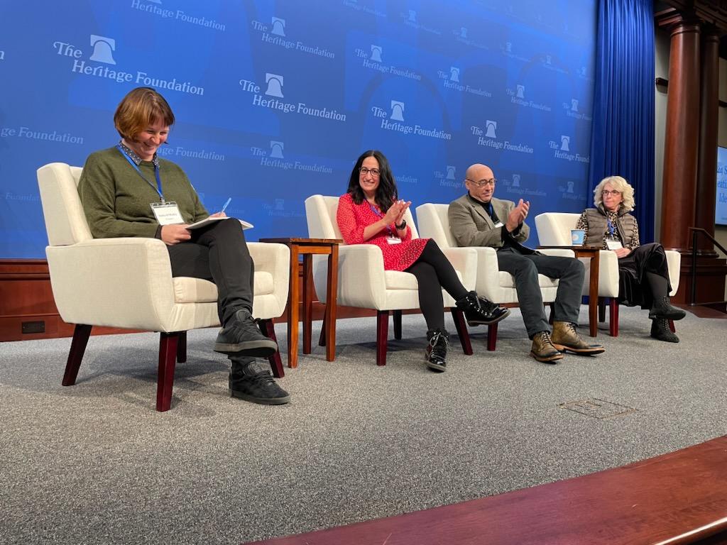 Pamela Garfield-Jaeger seated on a panel at The Heritage Foundation alongside three other panelists