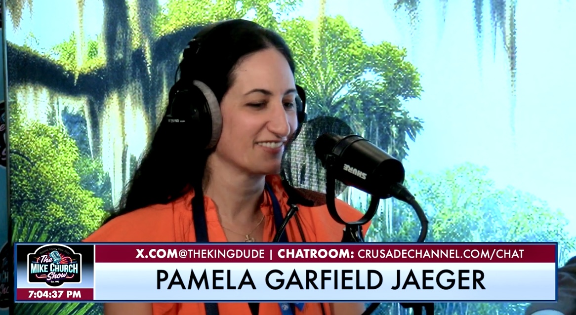 Pamela Garfield-Jaeger wearing headphones and speaking into a studio microphone during a radio interview